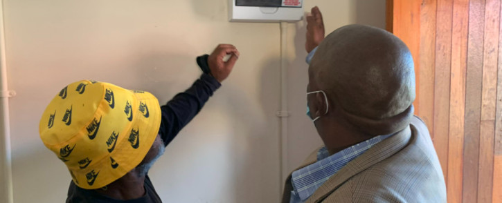 Eskom officials switched on the electricity at one of the residents’ homes in Delft on 11 April 2022. Picture: Kaylynn Palm/EWN.