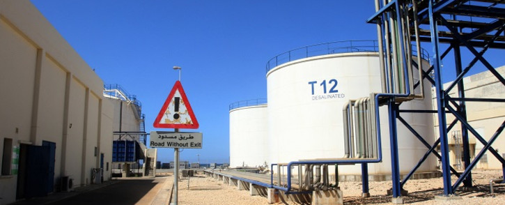 A picture shows storage tanks at the Zahrani power plant in Zahrani near the southern Lebanese city of Sidon (Saida) on September 18, 2021, as an oil tanker carrying fuel oil from Iraq, empties it's load at the power plant. Iraq will provide Lebanon with one million tonnes of fuel oil for its power plants in exchange for medical services, under a deal signed in July in Baghdad. Picture: Mahmoud Zayyat / AFP