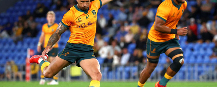 A file photo taken on 12 September 2021 shows Australia's Quade Cooper kicking a penalty as he leads Australia to victory in the Rugby Championship match against South Africa at Cbus Super Stadium on the Gold Coast. Picture: Patrick Hamilton/AFP