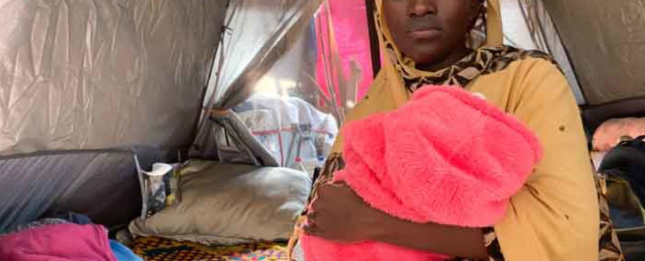 Refugee Fatuma Rukundo with her two-month-old baby inside their tent at the Wingfield military site in Goodwood where more than 800 refugees have been living since lockdown began. Picture: Kaylynn Palm.EWN