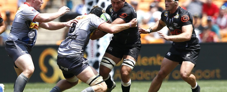 Stormers' David Meihuizen (2ndL) tackles Shark's Henco Venter (2ndR) during the Vodacom Superhero Sunday rugby match between the Cell C Sharks and the DHL Stormers at the FNB Stadium in Soweto on 19 January 2020. Picture: AFP