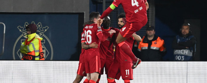Liverpool's players celebrate after forward Sadio Mane scored his team's third goal during the UEFA Champions League semifinal second leg football match between Liverpool and Villarreal CF at La Ceramica stadium in Vila-real on 3 May 2022. Picture: Paul ELLIS/AFP
