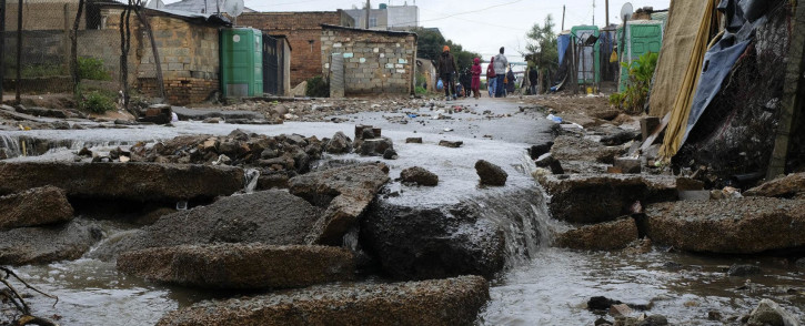 Heavy rains regularly flood the lower-lying areas of Kliptown in the south of Johannesburg (Photographs by Dennis Webster).