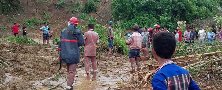 Bangladeshi firefighters search for bodies after a landslide in Rangamati on June 13, 2017. Picture: AFP