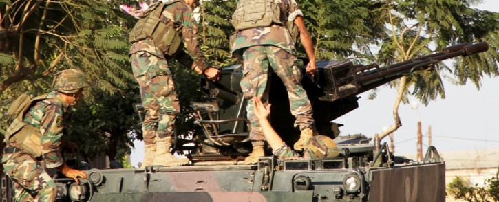 FILE: Lebanese army soldiers on their armored vehicle near the area of clashes with Sunni militants, Tripoli, Lebanon, 26 October 2014. Picture: EPA.