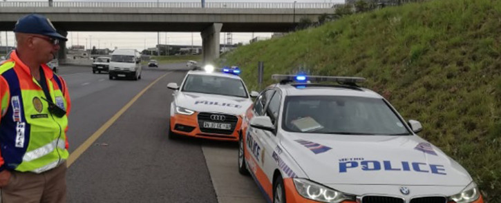A JMPD officer conducts a roadside check in Johannesburg. Picture: @AsktheChiefJMPD/Twitter.