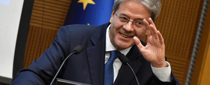 Italian Prime Minister Paolo Gentiloni gestures as he delivers a speech during the end-of-year press conference, at "Auletta" of the parliamentary groups of the Chamber of Deputies, in Rome, on 28 December 2017. Picture: AFP
