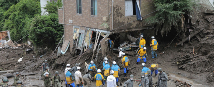 Members of Self-Defense Forces and police officers search for missing persons at the scene of a landslide following days of heavy rain in Atami, in Shizuoka Prefecture on July 5, 2021. Picture: STR / JIJI PRESS / AFP