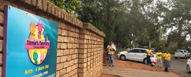 FILE: Parents gathered outside the Ninnie's Neurons Nursery School where a teacher was filmed beating children. Picture: EWN