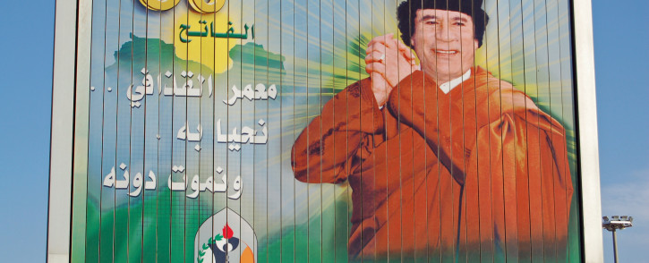 Billboard showing a celebrating Muammar Gaddafi. © basphoto/123rf.com