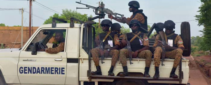 FILE: A picture take on 30 October 2018 shows Burkinabe gendarmes sitting on their vehicle in the city of Ouhigouya in the north of the country. Picture: AFP