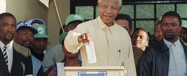 Nelson Mandela smiles broadly on 27 April 1994 in Oshlange, near Durban, as he casts his historic vote during South Africa's first democratic and all-race general elections. Picture: AFP