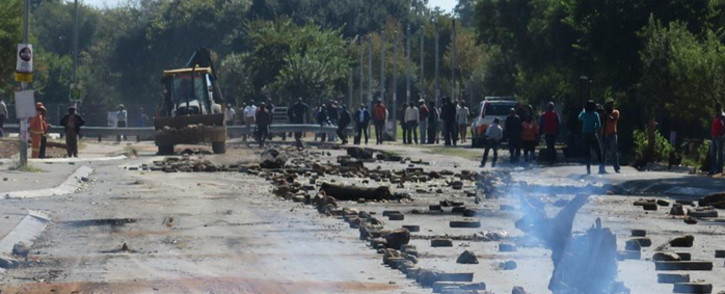 Khumalo Street was strewn with debris after scores of angry protesters took to the streets in Orlando West, in Soweto to protest against Eskom's pre-paid meters. Picture: Louise McAuliffe/EWN.