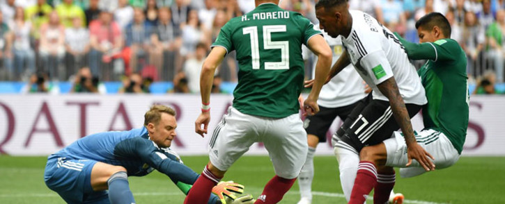 Germany goalkeeper Manuel Neuer makes a save under pressure from his Mexican opponents during their Fifa World Cup match on 17 June 2018. Picture: @DFB_Team_EN/Twitter