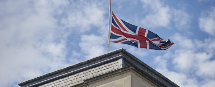 FILE: Britain's Union flag flies at half-mast above the Foreign and Commonwealth Office (FCO) in central London, on 28 June 2015, in memory of those killed after the mass shooting in Tunisia on Friday that left 38 people dead including at least 15 Britons. Picture: AFP.