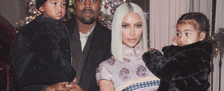 Kanye West (left) and Kim Kardashian with their two children. Picture: @KimKardashian/Twitter