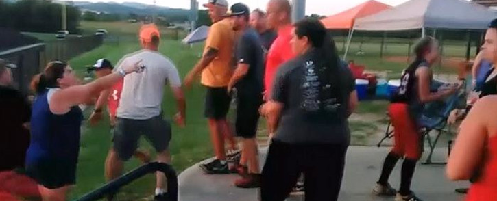 Video shows almost a dozen parents erupt into a massive fight at a girls softball tournament.