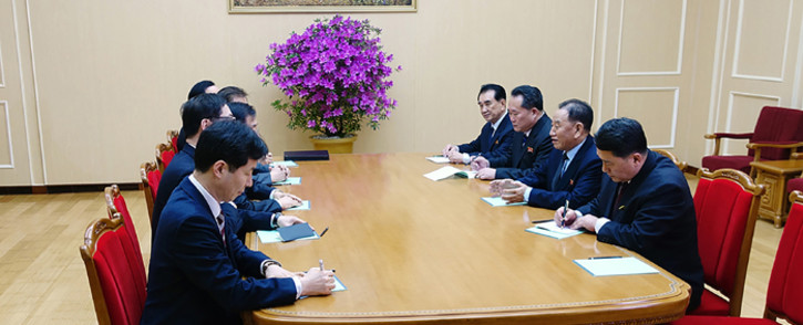 This handout photograph taken and released by the presidential Blue House on 5 March 2018 shows a South Korean delegation (L row), who travelled as envoys of the South's President Moon Jae-in, talking with General Kim Yong Chol (2nd R), who is in charge of inter-Korean affairs for North Korea's ruling Workers' Party, during their meeting in Pyongyang. Picture: AFP