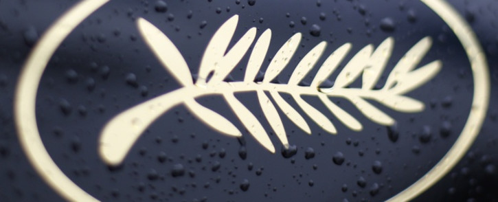 FILE: Rain drops on the Palm logo on an official car during the Cannes Film Festival. Picture: AFP.