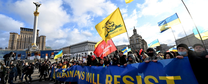 Ukraine demonstrators shout slogans as they march during a rally in Kyiv on 12 February 2022.