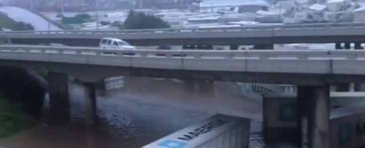Screengrab of containers drifting in floodwaters in KZN from video posted by Eyewitness News @ewnreporter