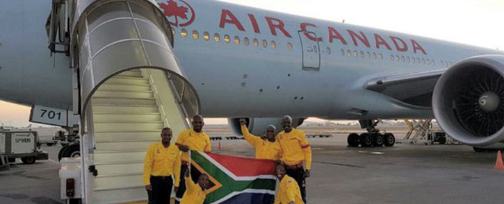 Over 300 South African firefighters boarded a Boeing 777 to Canada to assist Fort McMurray in battling raging wild fires, which have been blazing for over a month, on 29 May 2016. Picture: Supplied.