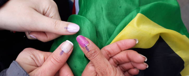 Voters abroad show off their inked thumbs. Picture: Supplied.