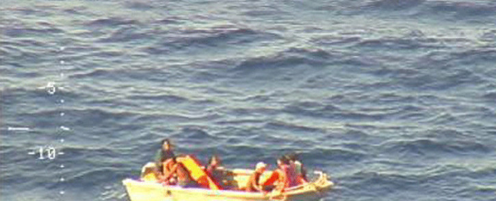 This video screengrab received from the New Zealand Defence Force on January 28, 2018 and taken from a Royal New Zealand Air Force P-3K2 Orion aircraft shows a five-metre dinghy adrift at sea in the Pacific Ocean with seven people on board, survivors from a ferry carrying 50 that was reported missing in Kiribati waters over a week ago. Picture: AFP.