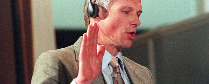 FILE: Janusz Walus takes an oath on 20 August 1997 at an amnesty hearing for the 1993 murder of SACP leader Chris Hani. Picture: AFP