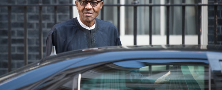 FILE: Nigeria's President-elect Muhammadu Buhari gets into his car in Downing Street, central London following a meeting with Britain's Prime Minister David Cameron (not pictured) in London on 23 May, 2015. Picture: AFP.
