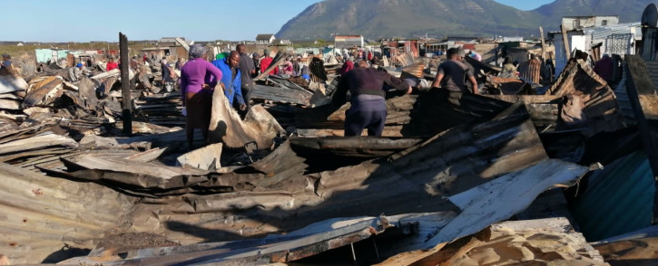 Masiphumele residents salvage their belongings after a fire. Picture: Supplied