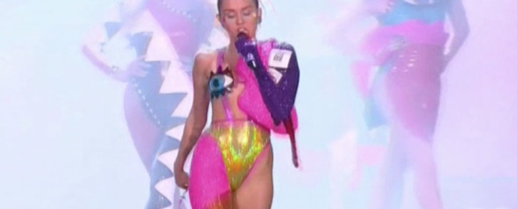Miley Cyrus's wardrobe at the music video awards 2015 and a look at the red carpet.Picture: CNN/screengrab