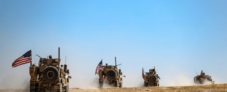 FILE: A US military convoy takes part in a joint patrol with Turkish troops in the Syrian village of al-Hashisha on the outskirts of Tal Abyad town along the border with Turkish troops, on 8 September 2019. Picture: AFP