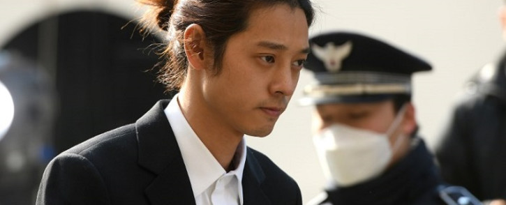 K-pop star Jung Joon-young (C) arrives for questioning at the Seoul Metropolitan Police Agency in Seoul on 14 March 2019. Picture: AFP