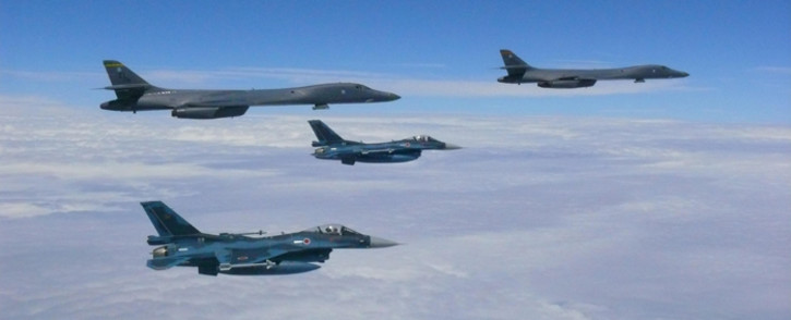 This image obtained from the US Air Force shows two Air Force B-1B Lancers flying from Andersen Air Force Base, Guam, for a 10-hour mission, flying in the vicinity of Kyushu, Japan, the East China Sea, and the Korean peninsula. Picture: AFP.