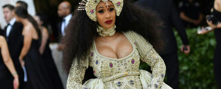 FILE: Cardi B arrives for the 2018 Met Gala in a custom Moschino outfit and bedazzled headpiece. Picture: AFP.