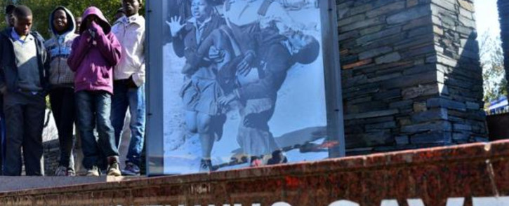 FILE: 12 year-old Hector Pieterson (seen on the picture at L) was shot on 16 June, 1976 during the Soweto uprising that today is a symbol of resistance to the brutality of the apartheid government. Picture: AFP.