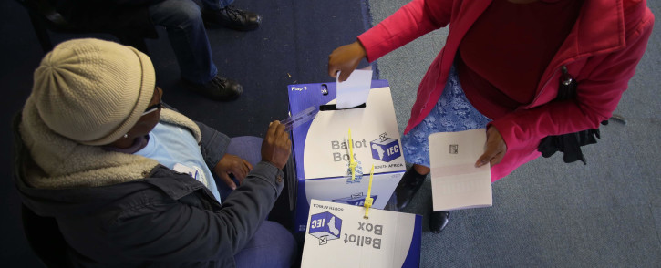 FILE: A voter placing her marked ballots into the local and national ballot boxes on 8 May 2019. Picture: Eyewitness News.