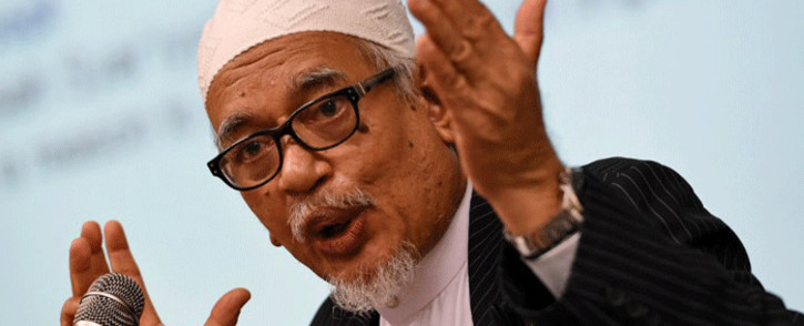 File: Hadi Awang, president of opposition Pan-Malaysia Islamic party (PAS), gestures during a lecture at S. Rajaratnam School of International Studies (RSIS) in Singapore on 28 April, 2015. Picture: AFP.