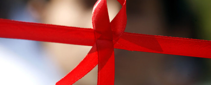 A red ribbon, the internationally known symbol of AIDS awareness.