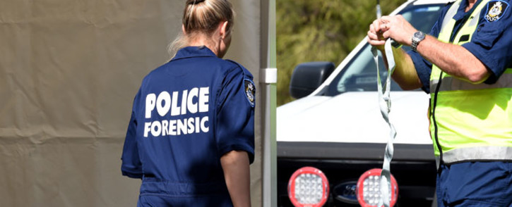 FILE: Australian forensic police examine a crime scene. Picture: AFP