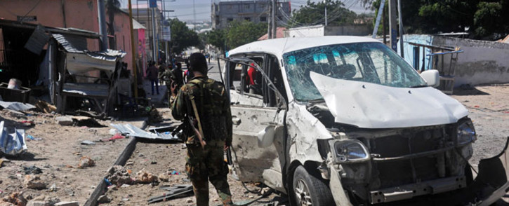 FILE: A Somali soldier stands at the scene of a car bomb attack near the Peace Hotel of the capital Mogadishu. Picture: AFP.