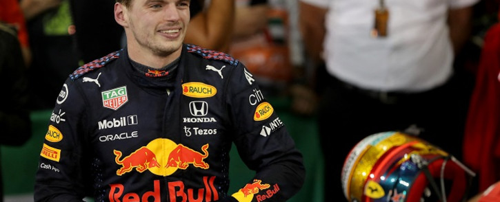 FIA Formula One World Champion Red Bull's Dutch driver Max Verstappen celebrates in the parc ferme of the Yas Marina Circuit after the Abu Dhabi Formula One Grand Prix on December 12, 2021. Picture: Kamran Jebreili / POOL / AFP