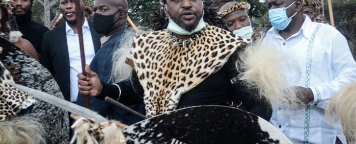 Prince Misuzulu Zulu (C) arrives with Zulu regiments to attend the provincial memorial service at the Khangelakamankegane Royal Palace in Nongoma on 7 May 2021 to pay his last respects to his mother, the late Queen Mantfombi Dlamini Zulu of the Zulu nation. Picture: AFP