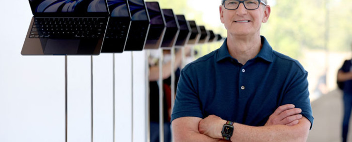 Apple CEO Tim Cook looks at a display of brand new redesigned MacBook Air laptop during the WWDC22 at Apple Park on 6 June 2022 in Cupertino, California. Picture: Justin Sullivan/Getty Images/AFP