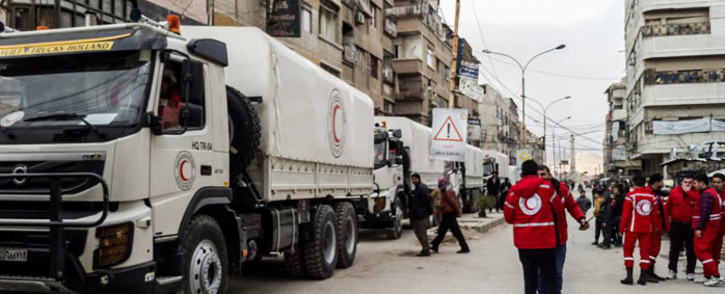 The Syrian Red Crescent and the United Nations deliver an aid convoy to Al-Nishabieh in Rural Damascus, Syria. The convoy carried relief items of food parcels, flour, nutrition, medicines and medical materials for 1,440 families there. Picture: Twitter/ @SYRedCrescent