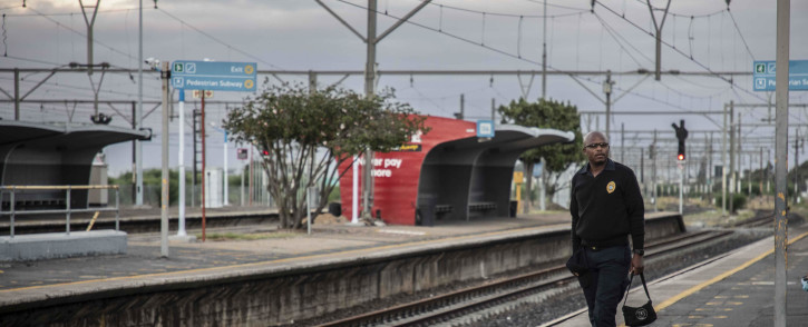 A commuter waiting for a Metrorail train in Cape Town. Picture: Abigail Javier/Eyewitness News
