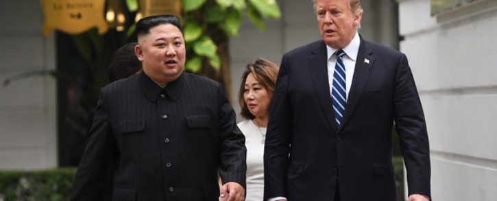US President Donald Trump (right) walks with North Korea's leader Kim Jong Un during a break in talks at the second US-North Korea summit at the Sofitel Legend Metropole hotel in Hanoi on 28 February 2019. Picture: AFP