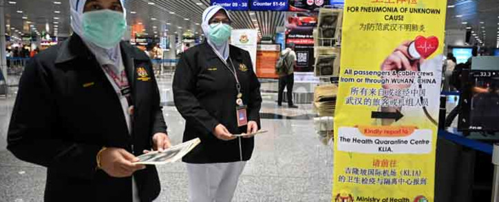 Malaysian health officers are deployed at Kuala Lumpur International Airport in Sepang on 21 January 2020 as authorities increased measures against the coronavirus. Picture: AFP.
