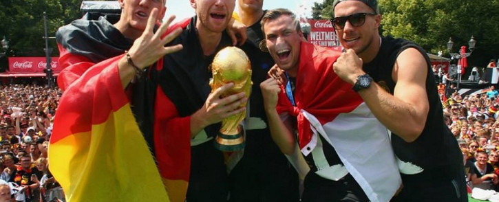 Germany players (L-R) Bastian Schweinsteiger, Per Mertesacker, Manuel Neuer, Kevin Grosskreutz and Lukas Podolski celebrate with the World Cup trophy. Picture: Official DFB Facebook Page.